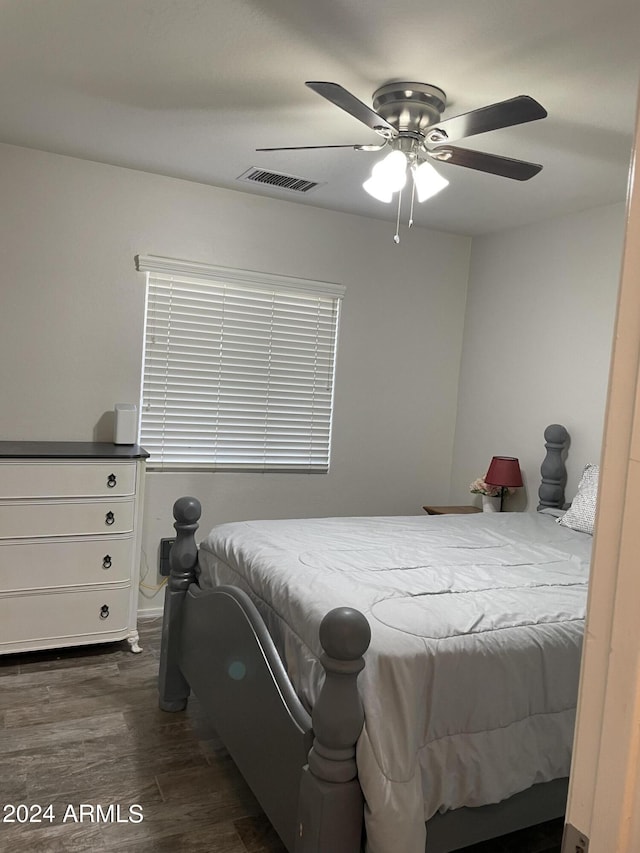 bedroom featuring ceiling fan and dark hardwood / wood-style floors