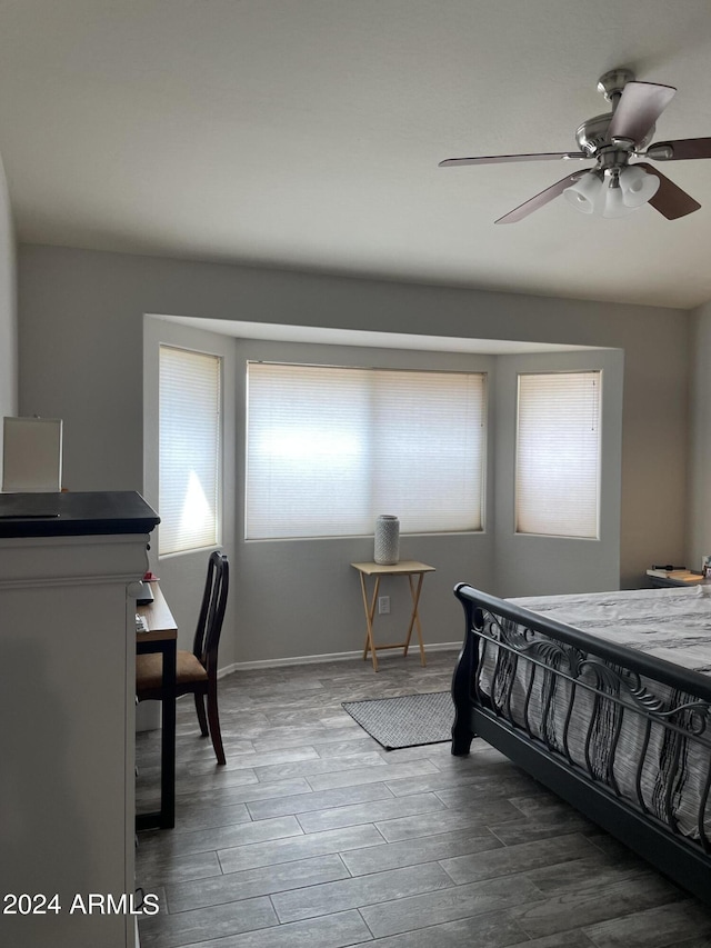 bedroom featuring ceiling fan and wood-type flooring