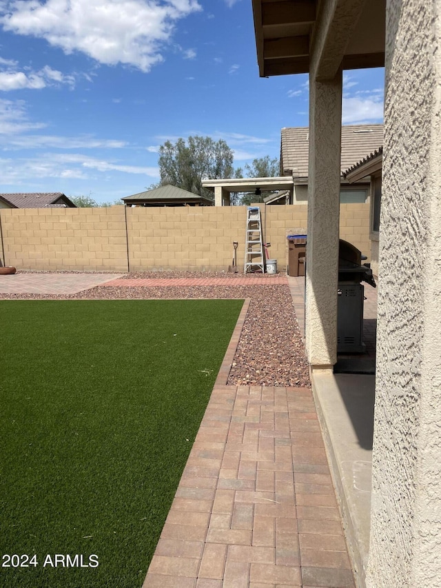 view of yard with a patio area