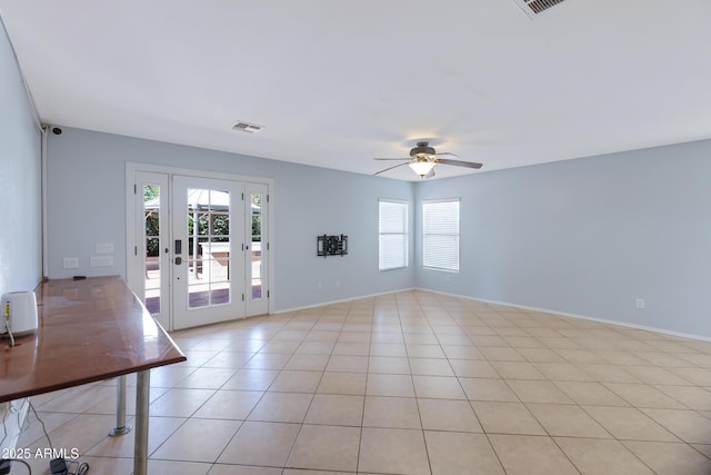 43232 W Magnolia Rd, Maricopa, AZ 85138 - empty room featuring a ceiling fan, light tile patterned flooring, french doors, and baseboards