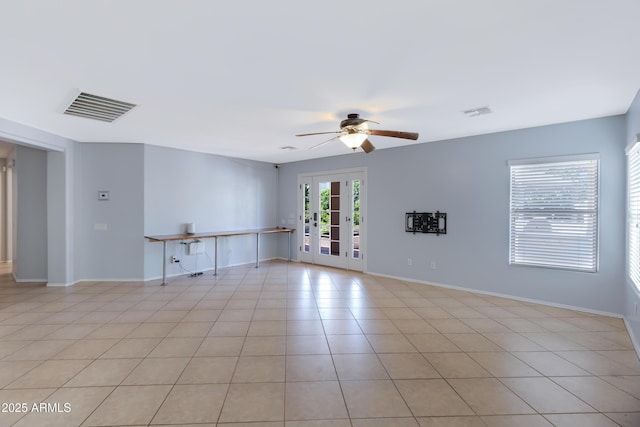 43232 W Magnolia Rd, Maricopa, AZ 85138 - spare room with ceiling fan, light tile patterned flooring, baseboards, and french doors