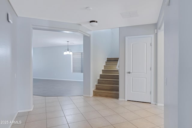 43232 W Magnolia Rd, Maricopa, AZ 85138 - staircase with baseboards, a chandelier, and tile patterned flooring
