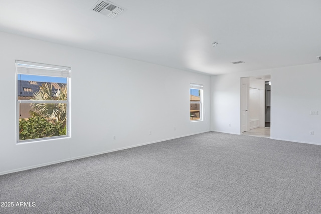 43232 W Magnolia Rd, Maricopa, AZ 85138 - empty room featuring light carpet and baseboards