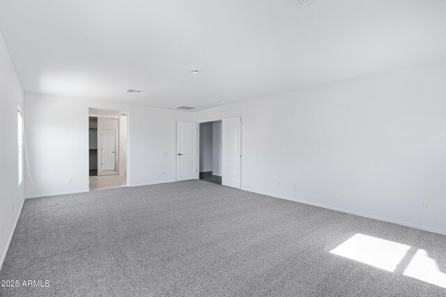 43232 W Magnolia Rd, Maricopa, AZ 85138 - empty room featuring carpet floors and baseboards