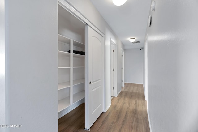 43232 W Magnolia Rd, Maricopa, AZ 85138 - hall featuring wood finished floors and baseboards