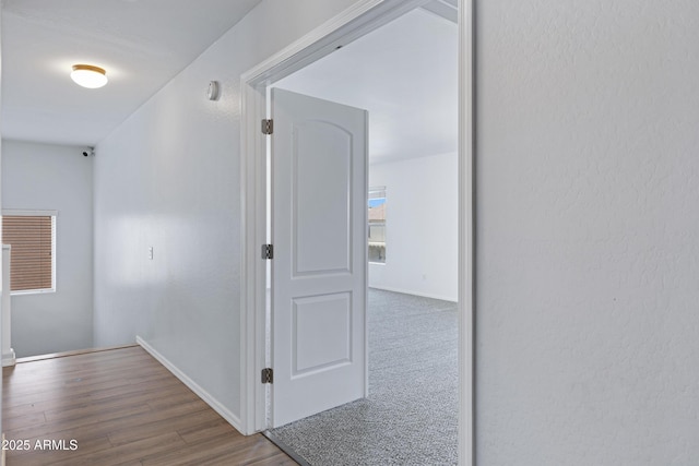 43232 W Magnolia Rd, Maricopa, AZ 85138 - hall featuring wood finished floors and baseboards