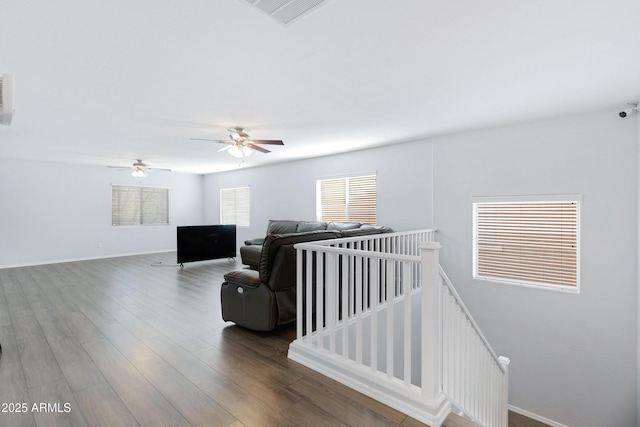 43232 W Magnolia Rd, Maricopa, AZ 85138 - living area with wood finished floors, baseboards, and a ceiling fan