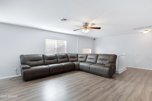 43232 W Magnolia Rd, Maricopa, AZ 85138 - living room with a ceiling fan, wood finished floors, and baseboards