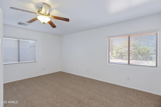43232 W Magnolia Rd, Maricopa, AZ 85138 - empty room with carpet flooring, a ceiling fan, and baseboards