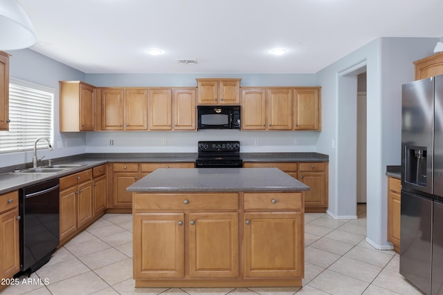 43232 W Magnolia Rd, Maricopa, AZ 85138 - kitchen with black appliances, a sink, dark countertops, and light tile patterned flooring