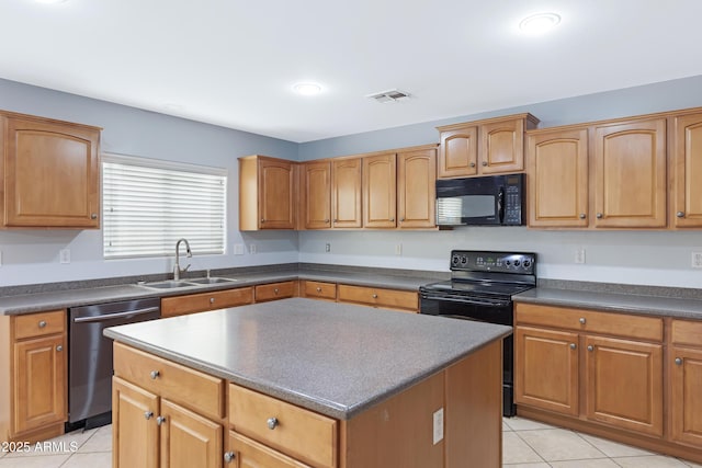 43232 W Magnolia Rd, Maricopa, AZ 85138 - kitchen with black appliances, a sink, light tile patterned floors, and dark countertops