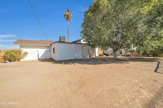 rear view of house with central air condition unit