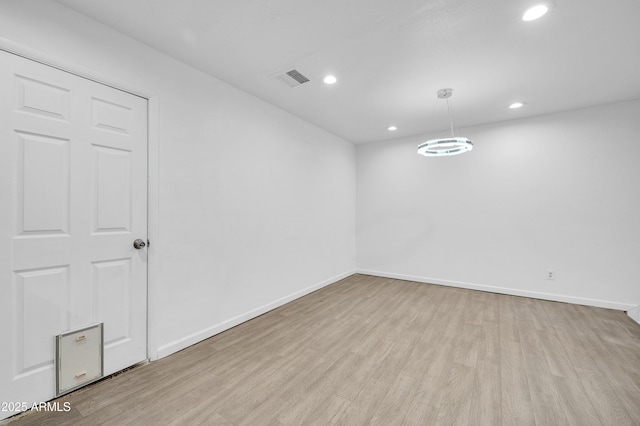 unfurnished room featuring light hardwood / wood-style flooring