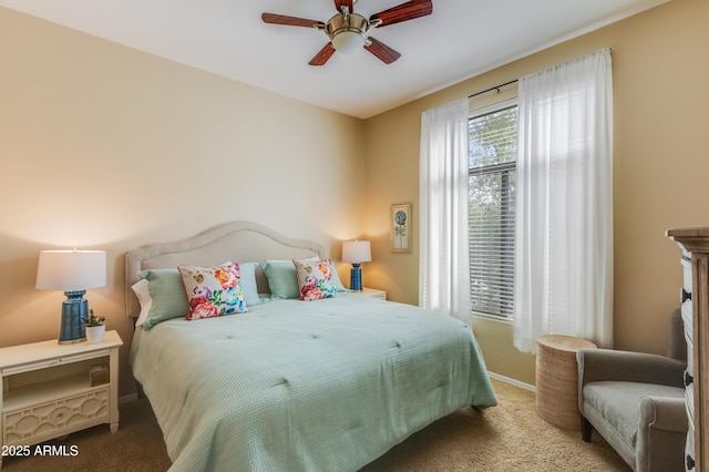 bedroom with baseboards, carpet floors, and ceiling fan