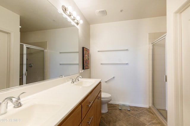 bathroom with a shower stall, toilet, and a sink