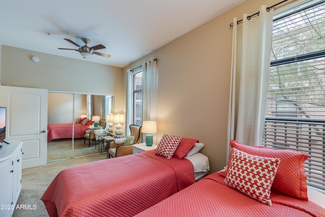 bedroom featuring carpet, a closet, and ceiling fan