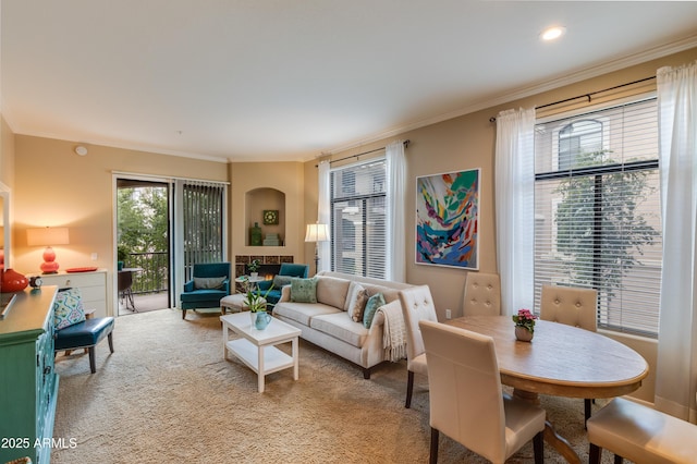 living area featuring crown molding, recessed lighting, and carpet floors