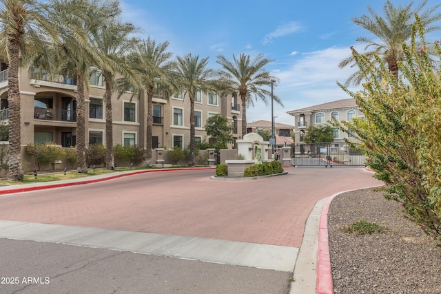 view of property's community featuring a residential view and a gate