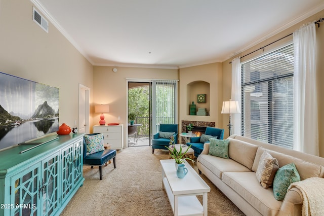 carpeted living area with visible vents and crown molding