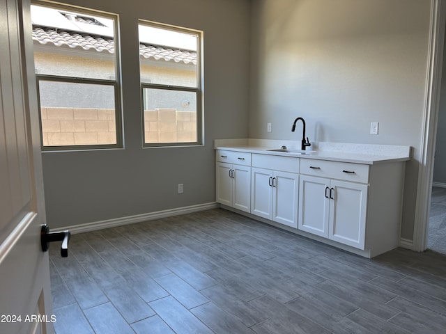 interior space with sink and light hardwood / wood-style flooring