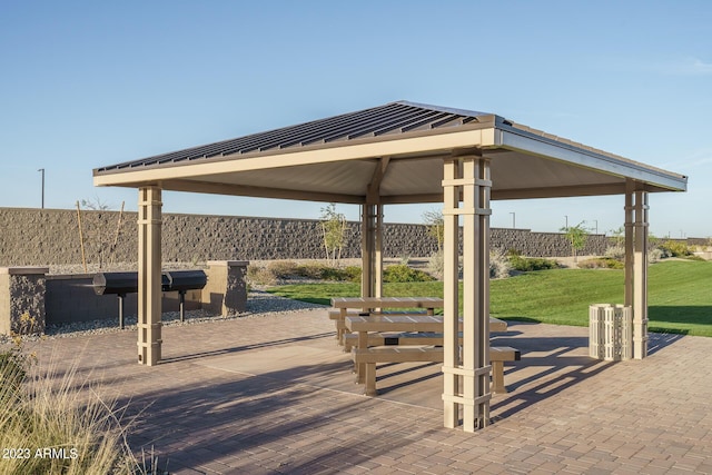 view of home's community with a gazebo and a lawn