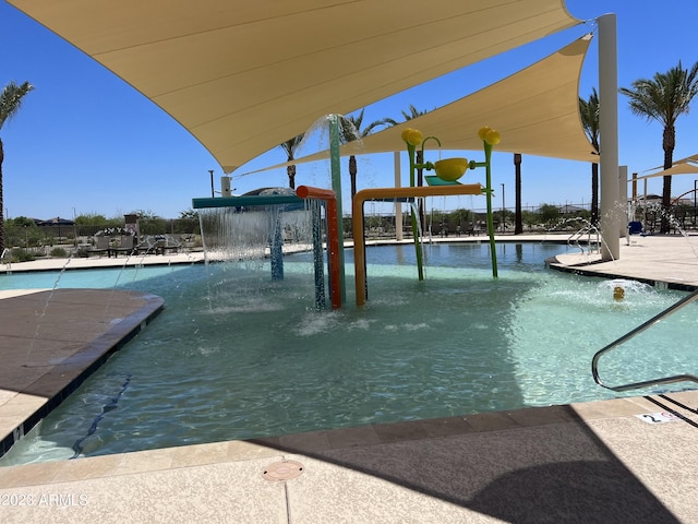 view of pool with pool water feature