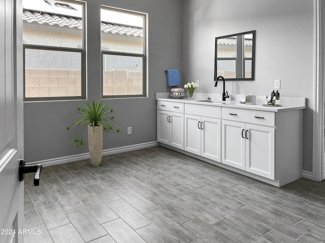 bathroom featuring plenty of natural light, vanity, and wood-type flooring