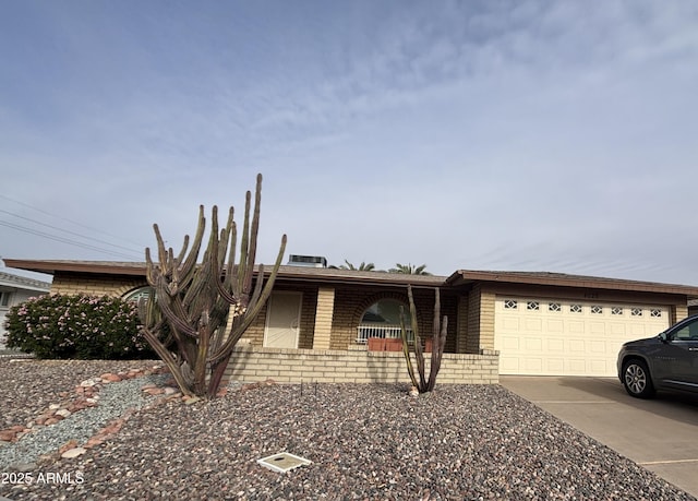 ranch-style house featuring a garage