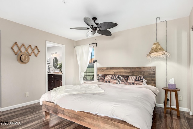 bedroom featuring dark hardwood / wood-style flooring, connected bathroom, and ceiling fan