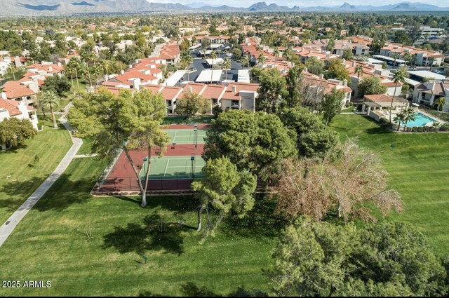 birds eye view of property with a mountain view