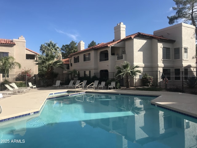 view of swimming pool with a patio area