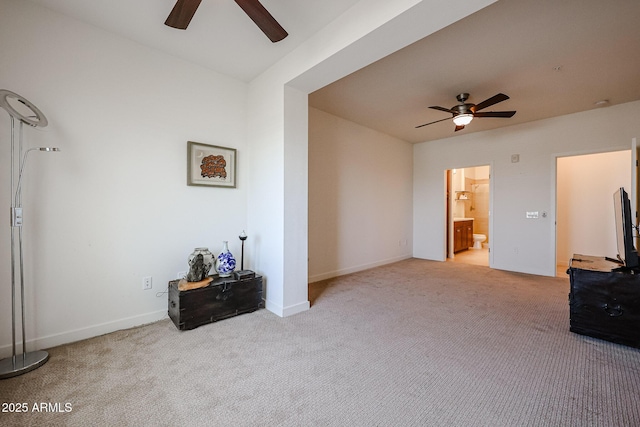 unfurnished living room with carpet floors, ceiling fan, and baseboards