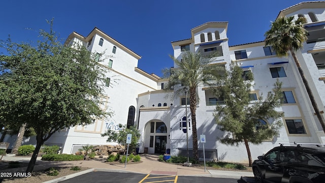 view of property with uncovered parking