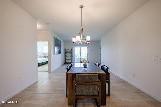 dining area with baseboards, an inviting chandelier, and light tile patterned floors