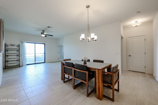 dining area featuring light tile patterned floors, ceiling fan with notable chandelier, and visible vents