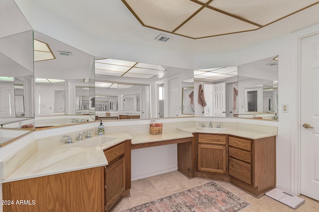 bathroom with tile patterned flooring and vanity