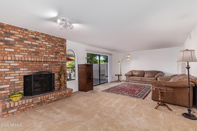 living room featuring a fireplace and light carpet