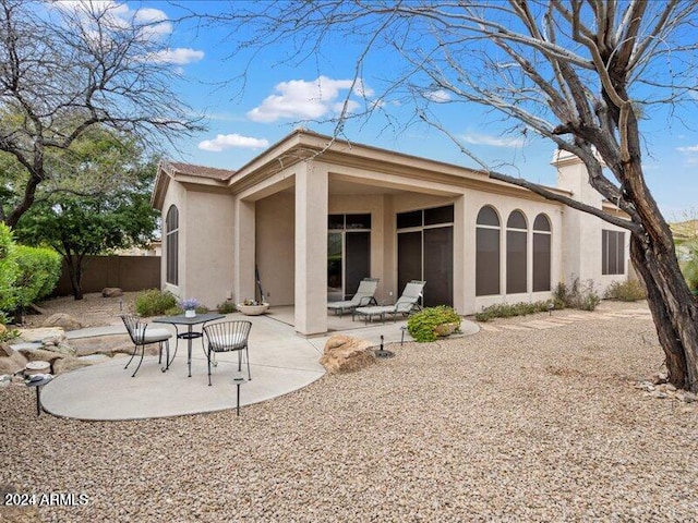 back of house featuring a patio area