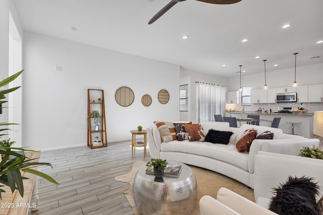 15718 W Polk St, Goodyear, AZ 85338 - living area featuring a ceiling fan, recessed lighting, and light wood-style flooring