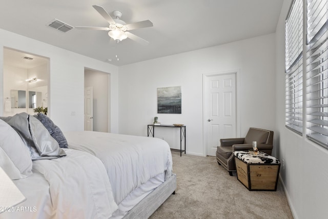 15718 W Polk St, Goodyear, AZ 85338 - carpeted bedroom featuring baseboards, ensuite bathroom, and a ceiling fan