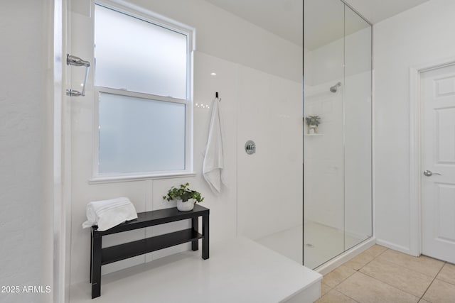 15718 W Polk St, Goodyear, AZ 85338 - full bathroom featuring walk in shower, tile patterned flooring, and plenty of natural light
