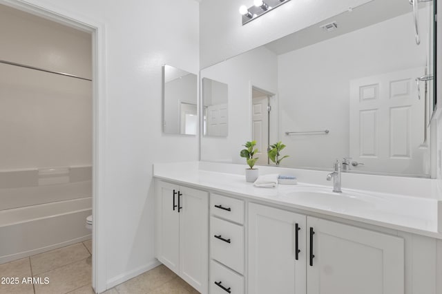 15718 W Polk St, Goodyear, AZ 85338 - bathroom with vanity, tile patterned floors, toilet,  shower combination, and baseboards