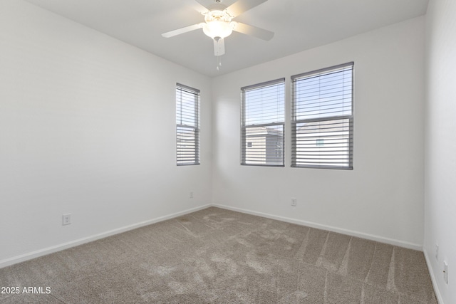 15718 W Polk St, Goodyear, AZ 85338 - spare room featuring carpet, a ceiling fan, and baseboards