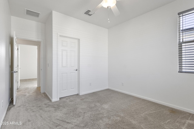 15718 W Polk St, Goodyear, AZ 85338 - unfurnished bedroom featuring carpet floors, baseboards, and a ceiling fan