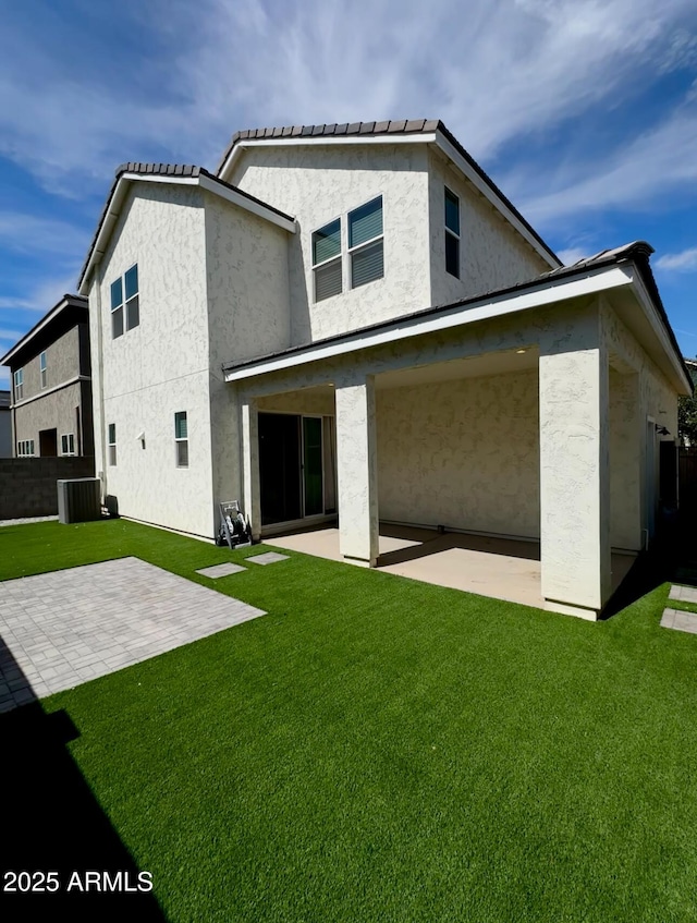 15718 W Polk St, Goodyear, AZ 85338 - back of house featuring a patio, cooling unit, and stucco siding