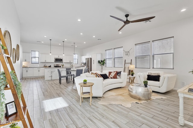 15718 W Polk St, Goodyear, AZ 85338 - living room with ceiling fan, recessed lighting, and light wood finished floors