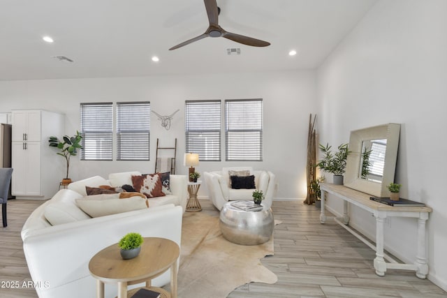 15718 W Polk St, Goodyear, AZ 85338 - living area with healthy amount of natural light, a ceiling fan, recessed lighting, light wood-type flooring, and baseboards