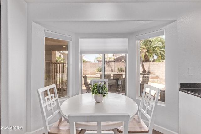 dining room featuring baseboards