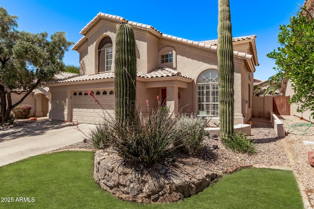mediterranean / spanish-style home with a garage, fence, stucco siding, driveway, and a tile roof