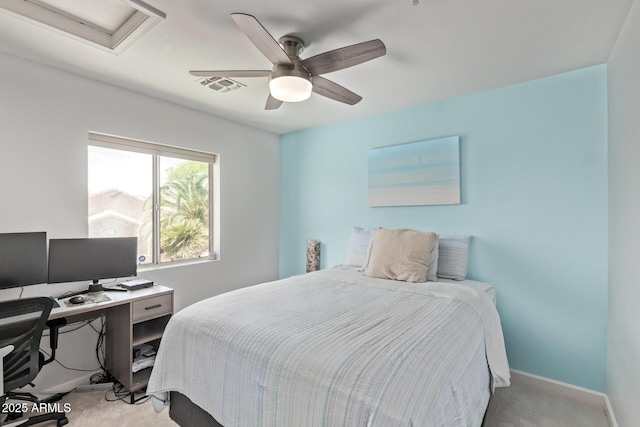 bedroom featuring ceiling fan, light colored carpet, attic access, baseboards, and visible vents